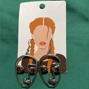 Abstract Facial Earrings with Red Gems